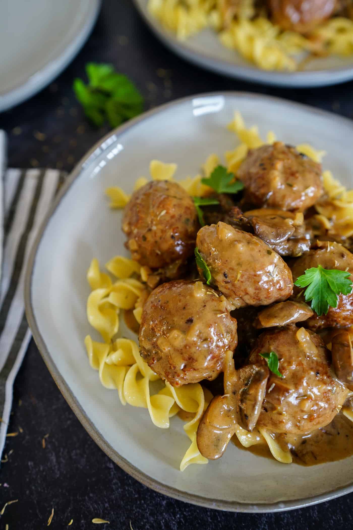 A Lily Love Affaire shares a recipe for meatball stroganoff served over egg noodles with mushroom gravy sauce