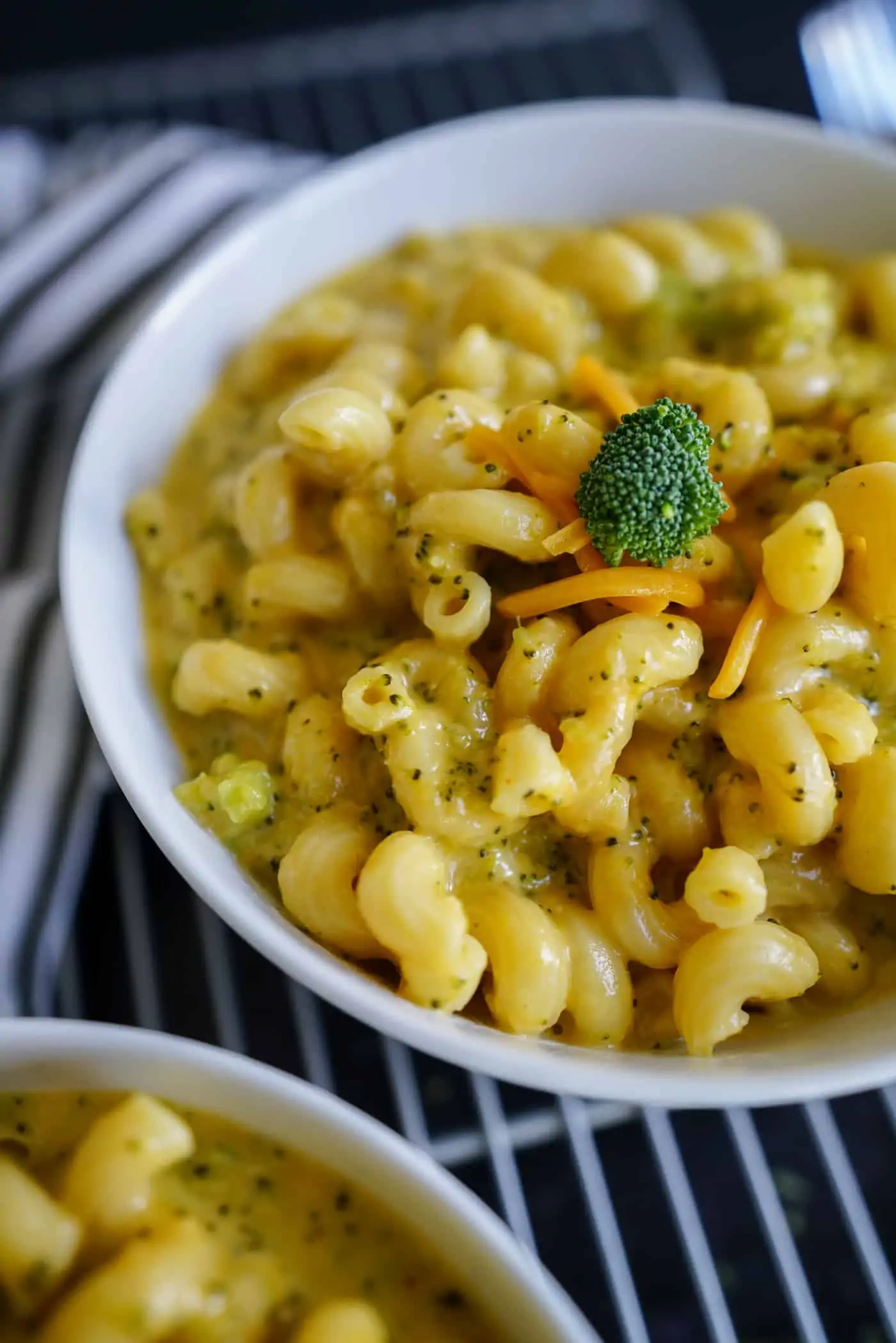 A Lily Love Affair shares a recipe for a large white bowl of broccoli mac and cheese