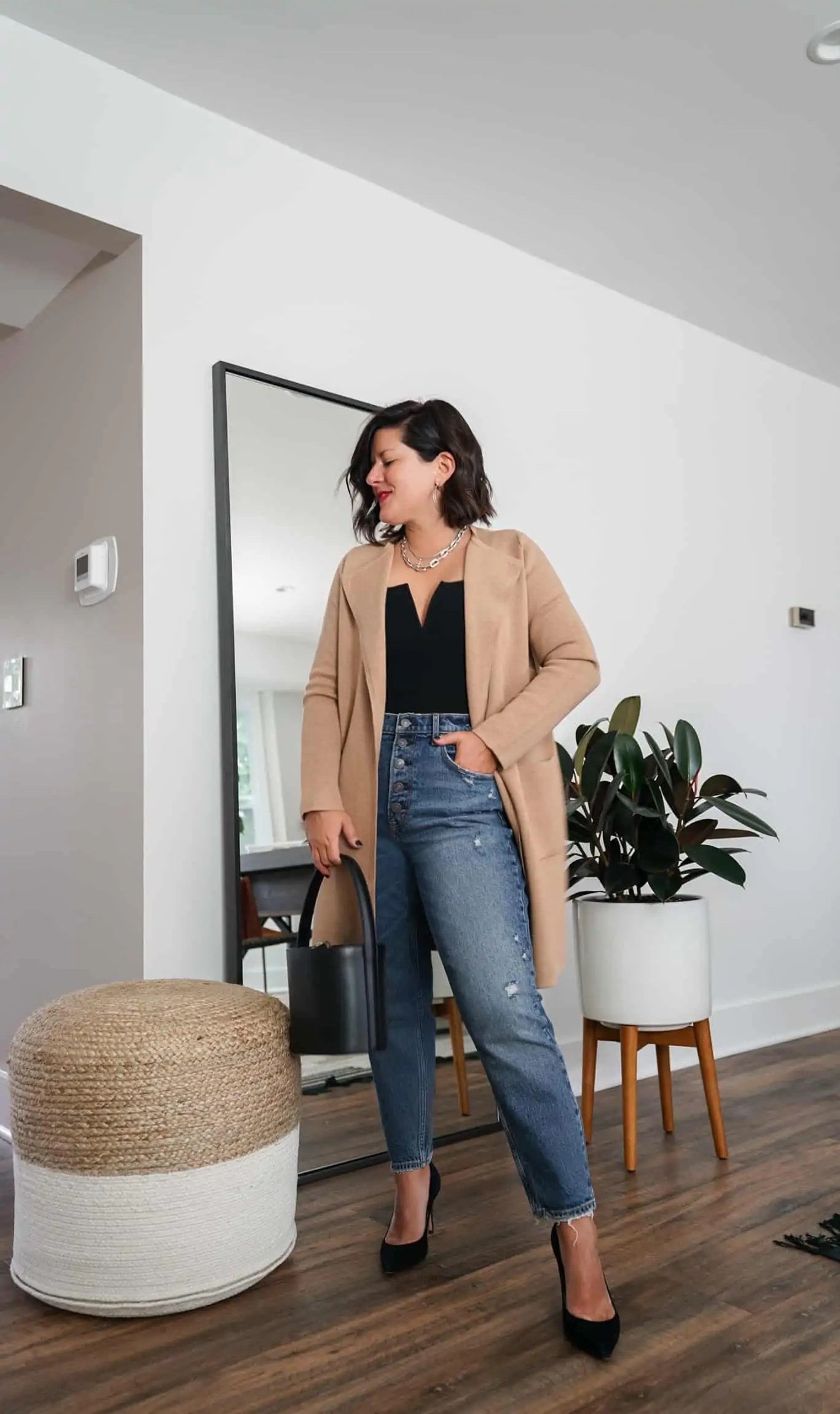 A Lily Love Affair shares how to wear a long cardigan with denim, black tank top and black heels