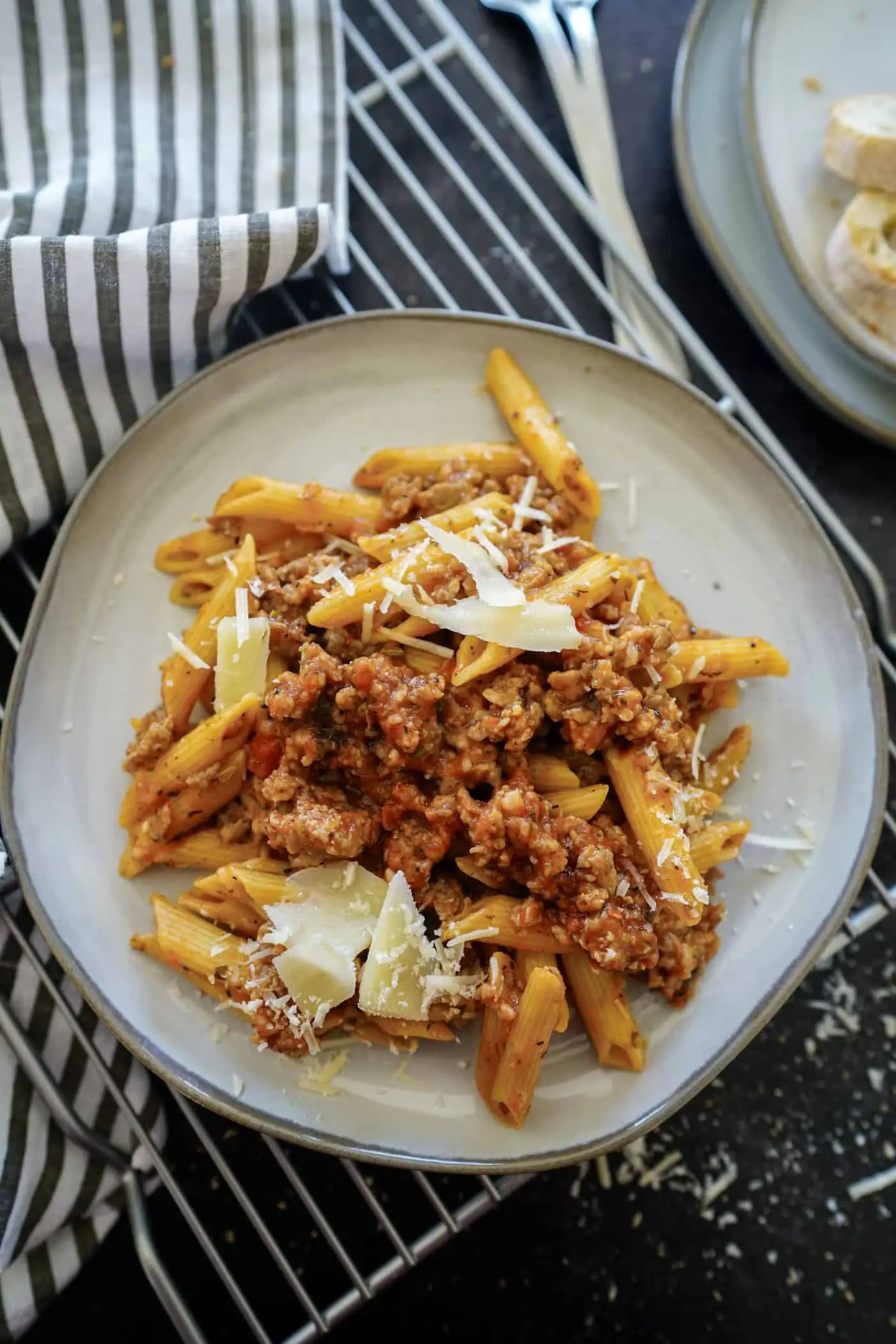 A plate of Instant Pot Penne Pasta made with suasage and parmesan cheese