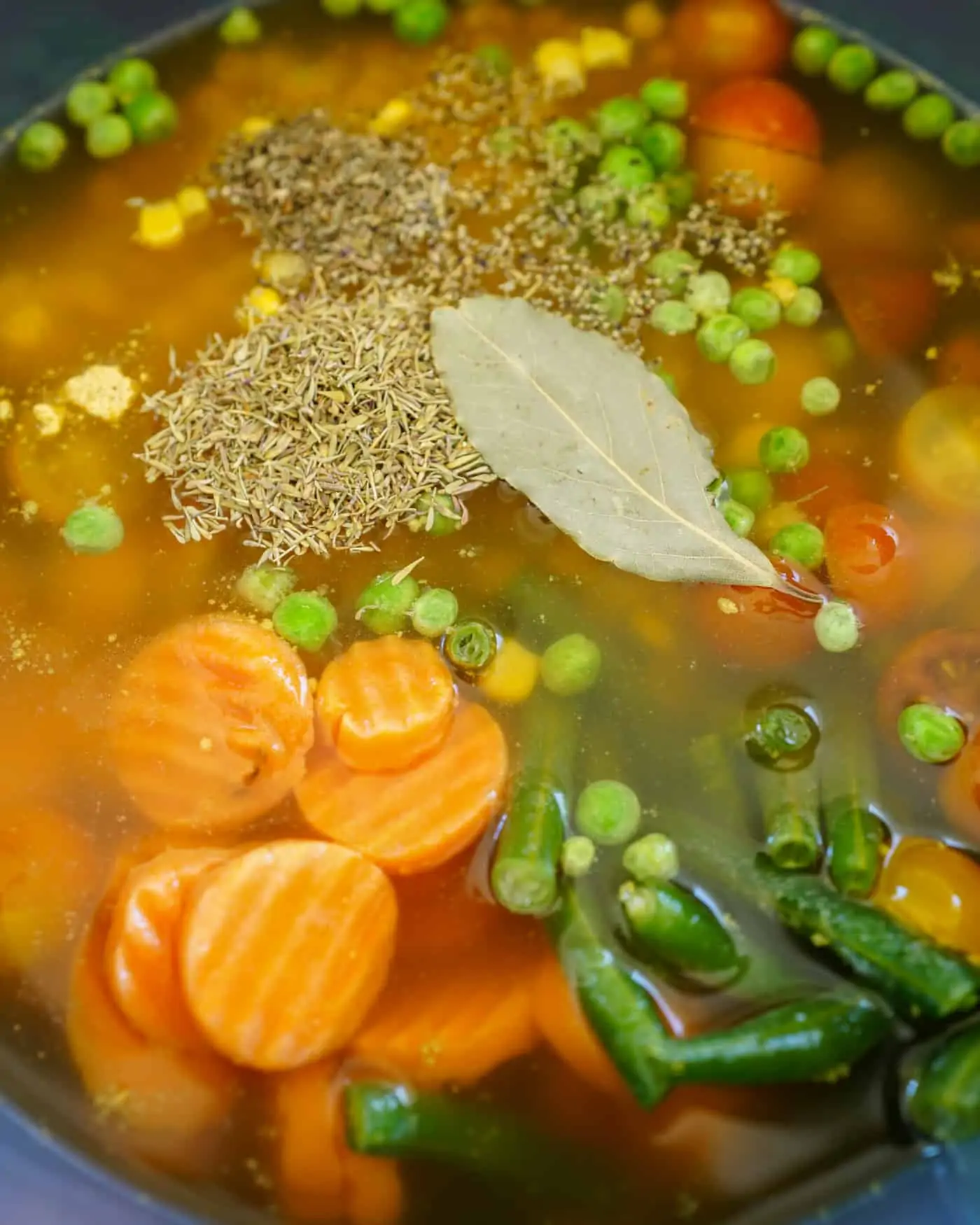 An Instant Pot filled with frozen vegetables and vegetable broth