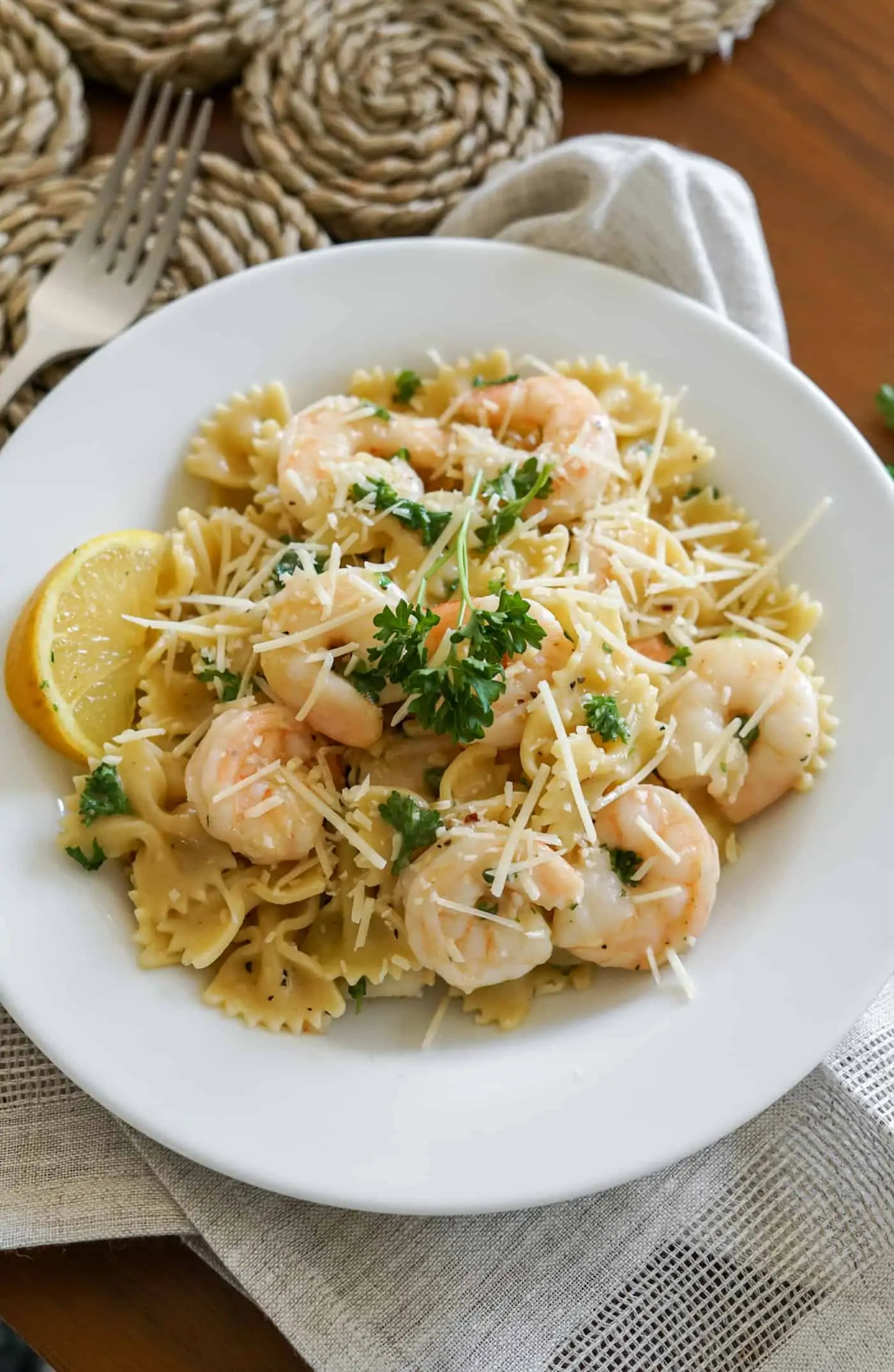 A large bowl of Instant Pot Shrimp Scampi topped with shrimp and fresh parsley