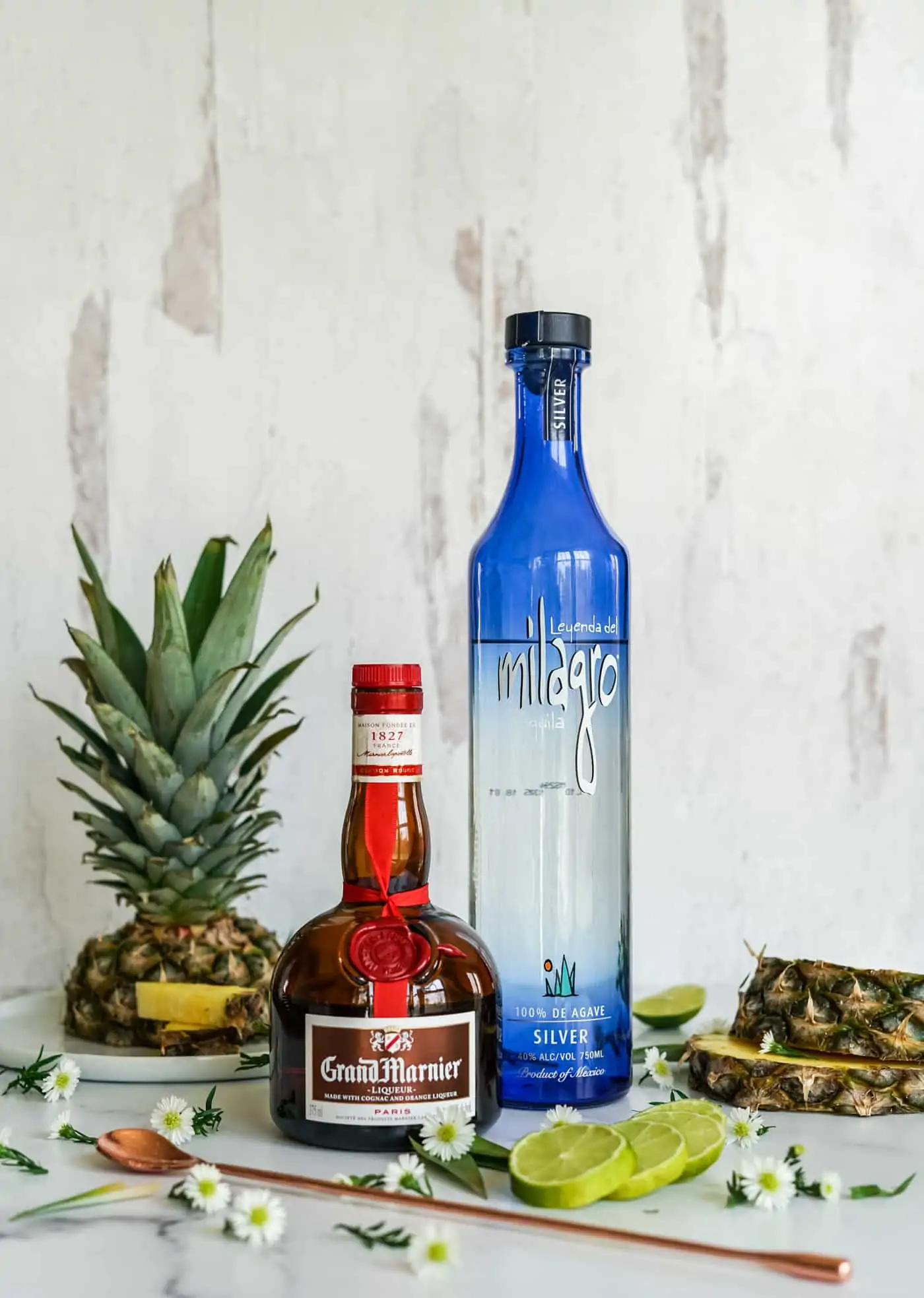 A bottle of Grand Marnier and Milagro silver tequila 