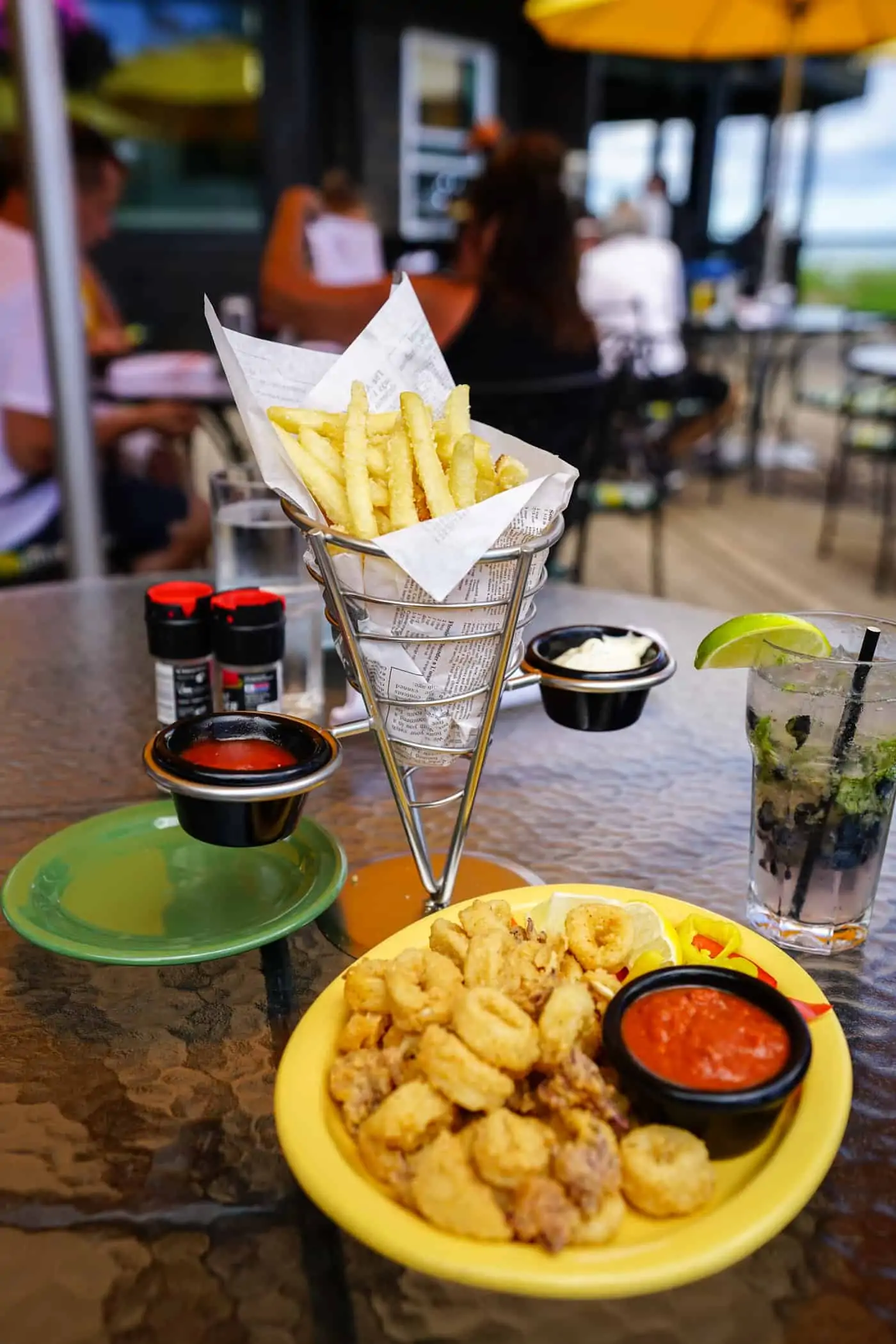 Basket of fries and a plate of calamari 